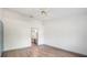 Bright bedroom featuring an en-suite bathroom and wood-look flooring at 3055 Steeplechase Dr, Lakeland, FL 33811