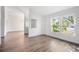 Bright living room with wood floors and a large window, offering plenty of natural light at 3055 Steeplechase Dr, Lakeland, FL 33811