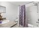 Full bathroom featuring a shower-tub combo, a single vanity, and neutral tones at 547 Windsor Pl, Davenport, FL 33896