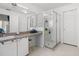 Bathroom with walk-in shower, ample counter space, and custom mirrors at 547 Windsor Pl, Davenport, FL 33896