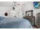 Primary bedroom boasts a ceiling fan, and hard wood floors at 547 Windsor Pl, Davenport, FL 33896