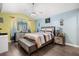 Bedroom featuring a contemporary design, with warm tones and decorative accents at 547 Windsor Pl, Davenport, FL 33896