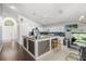 Bright kitchen with a breakfast bar, a dining table, and modern appliances at 547 Windsor Pl, Davenport, FL 33896