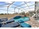 Beautiful pool with sun loungers and view of backyard at 547 Windsor Pl, Davenport, FL 33896
