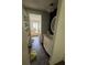 This bathroom has a single sink vanity, a bathtub, and shelving storage space at 4266 County Road 691, Webster, FL 33597