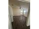 This bedroom features wood floors, natural lighting and a ceiling fan at 4266 County Road 691, Webster, FL 33597