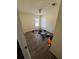 Empty bedroom featuring wood floors, natural light from two windows, and a ceiling light at 4266 County Road 691, Webster, FL 33597