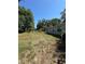 Exterior view of a cozy home with a spacious side yard offering plenty of outdoor space at 4266 County Road 691, Webster, FL 33597