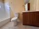Bathroom featuring a vanity with wooden cabinets and a shower-tub combo at 206 W 9Th St, Lakeland, FL 33805