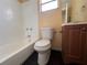 Clean bathroom with a white toilet, a vanity, and a shower-tub combo at 206 W 9Th St, Lakeland, FL 33805