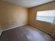 Bedroom featuring a window and neutral walls at 206 W 9Th St, Lakeland, FL 33805