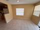 Bright dining room with tiled floor, adjacent to the kitchen area at 206 W 9Th St, Lakeland, FL 33805