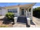 Charming home featuring a covered porch, and a quaint, landscaped front yard at 206 W 9Th St, Lakeland, FL 33805