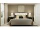 Cozy bedroom featuring a comfortable bed, stylish bedside tables, and modern decor for a relaxing ambiance at 3019 Totem Rd, Eagle Lake, FL 33839
