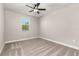 Bedroom featuring carpeting, neutral walls, a ceiling fan, and a window with natural light at 7688 Somersworth Dr, Kissimmee, FL 34747
