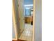 Bathroom features a light wood vanity, tiled floor and decorative glass block window at 208 Shepard Ave, Dundee, FL 33838