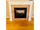 Elegant fireplace framed by white pillars and brickwork for comfort and charm at 208 Shepard Ave, Dundee, FL 33838