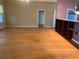 Expansive living space featuring hardwood flooring, natural light, and an open layout great for relaxing and entertaining at 208 Shepard Ave, Dundee, FL 33838