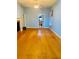 Spacious living room with hardwood floors, fireplace, and an open floor plan at 208 Shepard Ave, Dundee, FL 33838