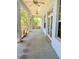 Large screened-in porch with ceiling fans provides relaxing outdoor living at 208 Shepard Ave, Dundee, FL 33838
