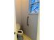 Small toilet room features a stained glass window and support railing at 208 Shepard Ave, Dundee, FL 33838