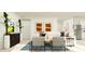 Open-concept living room flows seamlessly into the kitchen, perfect for modern living and entertaining at 2103 Forage Dr, Kissimmee, FL 34746