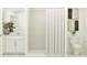 Bright bathroom featuring a shower with ceramic tiling and a white vanity at 2109 Forage Dr, Kissimmee, FL 34746
