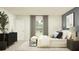 A bedroom with bedside tables, a bench, large window, and natural light at 2109 Forage Dr, Kissimmee, FL 34746