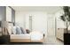 This bedroom is bright and airy with an accent wall and features a large walk-in closet at 2109 Forage Dr, Kissimmee, FL 34746