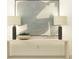 Console table with lamps and plants in a room with white walls. Minimalist decor at 2109 Forage Dr, Kissimmee, FL 34746