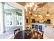 Breakfast nook with chandelier and view of pool and patio at 2660 Wyndsor Oaks Way, Winter Haven, FL 33884