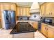 Well-equipped kitchen featuring an island, modern appliances, and ample cabinet space at 2660 Wyndsor Oaks Way, Winter Haven, FL 33884
