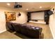 Home theater room featuring comfortable seating, a large screen, and professional-grade audio equipment at 2660 Wyndsor Oaks Way, Winter Haven, FL 33884