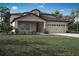 Charming two-story home with landscaped yard, covered porch and a two car garage at 3335 Chinotto Dr, Lake Alfred, FL 33850