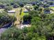 A high-angle view of homes nestled in a tree filled neighborhood at 6702 Brookridge Trl, Lakeland, FL 33810