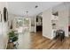 Open dining room with wood floors, views of the backyard and open to the kitchen at 6702 Brookridge Trl, Lakeland, FL 33810