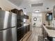 Efficient kitchen featuring dark cabinetry, modern appliances, ample counter space, and wood flooring at 6702 Brookridge Trl, Lakeland, FL 33810