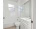 Cozy bathroom featuring a tub, toilet, vanity, and window for natural light at 1046 Island Pointe Dr, Winter Garden, FL 34787