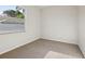 A bright bedroom with a large window and neutral carpet at 1046 Island Pointe Dr, Winter Garden, FL 34787