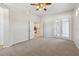 Serene bedroom offers neutral carpet, ceiling fan, and double doors, creating a peaceful retreat at 1046 Island Pointe Dr, Winter Garden, FL 34787