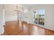 Bright foyer showcasing hardwood floors, elegant lighting, and a view to the front door at 1046 Island Pointe Dr, Winter Garden, FL 34787