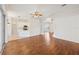 Spacious living room with hardwood floors, flowing into the open-concept kitchen and dining area at 1046 Island Pointe Dr, Winter Garden, FL 34787