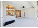 Covered patio with ceiling fan, with view to interior windows at 1046 Island Pointe Dr, Winter Garden, FL 34787