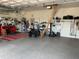 Spacious garage with epoxy flooring, organized storage and electric bikes at 1415 Colonial Ct, Winter Haven, FL 33884