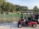 A golf cart sits ready near the pasture at 1415 Colonial Ct, Winter Haven, FL 33884