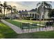 Community lawn bowling area, clubhouse in background, inviting outdoor activity at 1415 Colonial Ct, Winter Haven, FL 33884