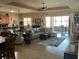 Spacious living area with comfortable seating, ample natural light, and direct access to the outdoor patio at 1415 Colonial Ct, Winter Haven, FL 33884