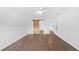 An open bedroom that features wood floors and sliding closet doors at 8804 Harrison Rd, Lakeland, FL 33810