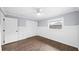 This bedroom offers wood-look floors, a window, and ample closet space at 8804 Harrison Rd, Lakeland, FL 33810