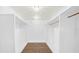 Walk-in closet with shelving, wood look floors and a chandelier at 8804 Harrison Rd, Lakeland, FL 33810
